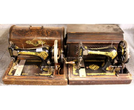 Two vintage Singer sewing machines.