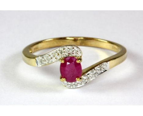 A 9ct yellow gold ruby and diamond set ring (O.5).