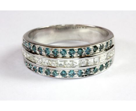 A 14ct white gold (stamped 585) half eternity ring set with three rows of fancy blue and white diamonds (overall approx. 0.90