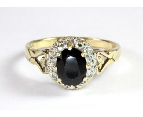 A 9ct yellow gold sapphire and diamond cluster ring (Q.5).