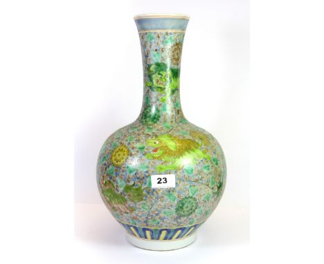 A 19th / early 20th century Chinese hand painted porcelain vase, decorated with fu dogs, six character mark to base for Kangx