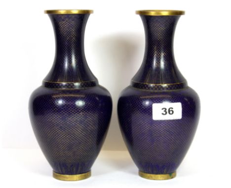 A pair of mid 20th century Chinese cloisonné vases decorated with deep blue fish scale decoration, H. 22cm.