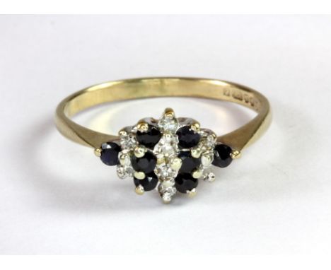 A 9ct yellow gold sapphire and diamond cluster ring (M.5).