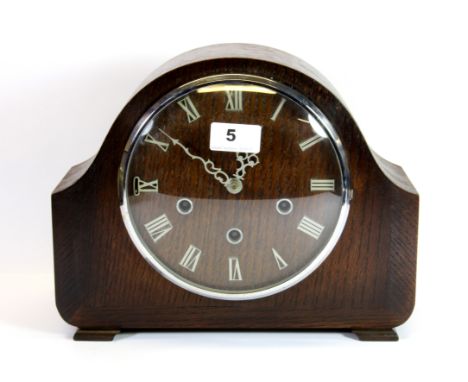 A 1930's chiming oak mantle clock, H. 23cm.