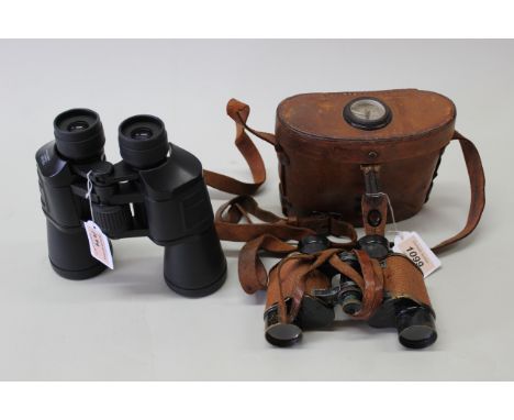 A pair of WWII era U S Army Signal Corps binoculars S/No.EE-257489 by Bausch and Lomb, complete with correct leather case wit
