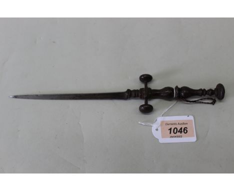 A cast iron stiletto with a tapering triangular blade, marked to one edge with increments of 10 to 100 to a cast cross guard 