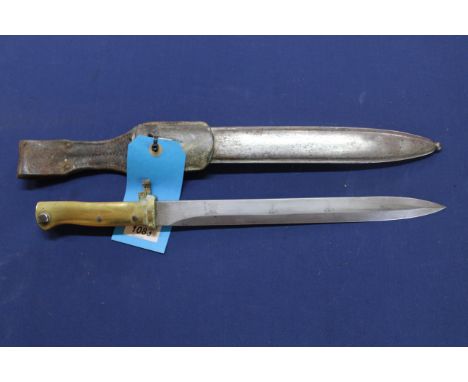 A Mauser 'Ersatz' bayonet with correct scabbard and leather frog, this is a scarce brass hilted model 1915 (muzzle ring as fo