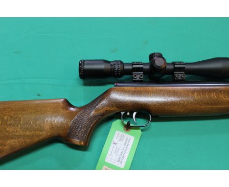 A Weihrauch HW 80K .22 cal air rifle, complete with a Hawke 3-9x40 scope and moderator, a fine and classic air rifle, as a po