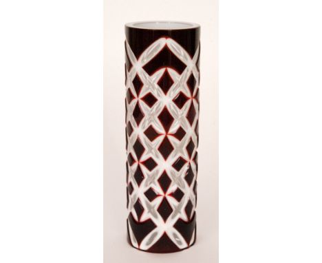 Karel Wunsch - Czechoslovakian - A post war cylinder cut glass vase cased in ruby over opal over clear crystal and flash cut 