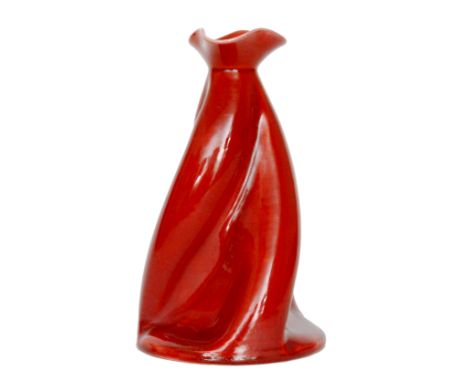 Christopher Dresser - Ault Pottery - A Propeller vase of wrythen form decorated in a red glaze, unmarked, height 21cm