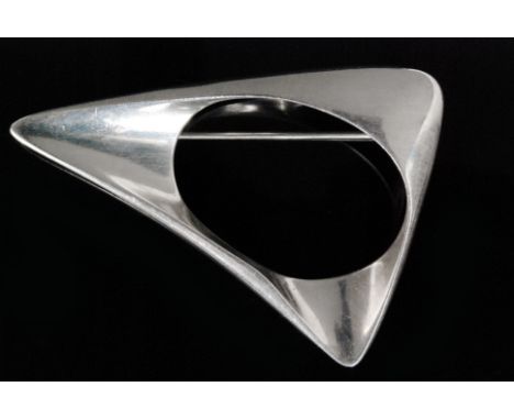 Henning Koppel for Georg Jensen - A Danish Sterling silver brooch number 375, of triangular from with open circular central s