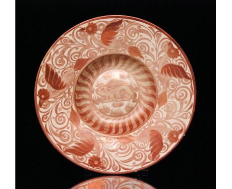 William de Morgan - A late 19th Century ruby lustre dish decorated by Charles Passenger with a rabbit to the central well wit