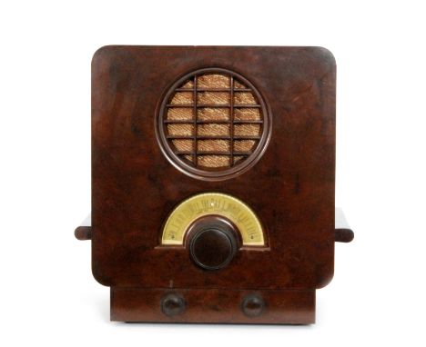 Serge Chermayeff - EKCO - A brown Bakelite radio, model A.D 64 with circular front speaker and half moon dial, introduced 193