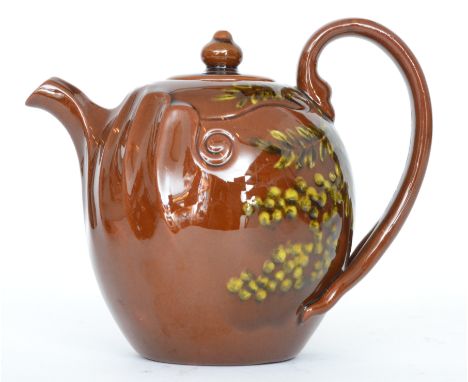 Linthorpe Pottery - A small shape 1246 teapot, the ovoid body with fluted moulding to the spout and a bifurcated handle decor