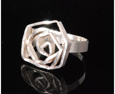 Soren S Borup - A 1970s Danish Sterling Silver corsage bangle, the head designed as a stylised abstract flower with planished