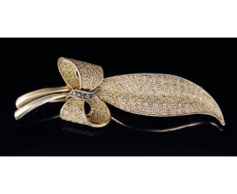 Fahrner - A 1920s German silver gilt and marcasite leaf brooch, the ribbon tied curled leaf with all over canetille work deco