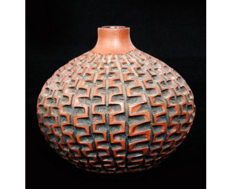 Beatrice Bolton - Poole Pottery - An Atlantis vase of compressed form decorated with a carved repeat pattern, impressed mark,