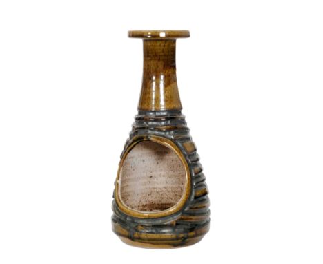 Carol Kellet - Poole Pottery - An A10 Atlantis range lamp base, the whole in a green brown speckled glaze with carved tenmoku