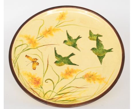 Clarissa Ault - Ault Pottery - An early 20th Century Arts and Crafts charger decorated with four green birds in flight follow