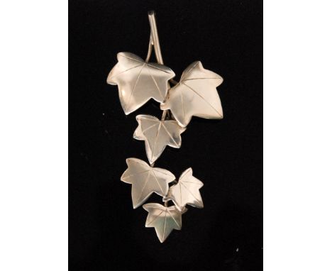 Geoffrey Bellamy for Ivan Tarratt - A 1960s silver foliate brooch designed as two groups of three ivy leaves, the second grou