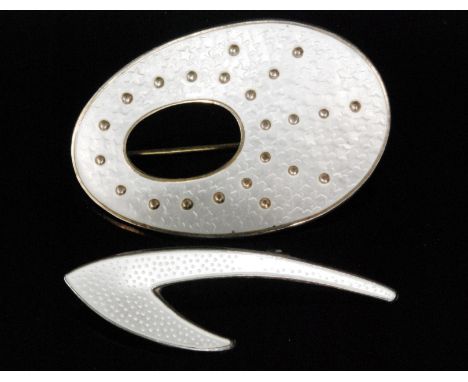 Oystein Balle - Stavenger - A Norwegian silver gilt and guilloche enamel brooch, of shaped oval outline with a white enamel s