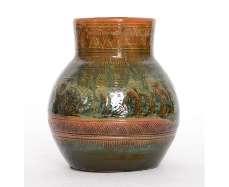 Christopher Dresser - Linthorpe Pottery - A vase of ovoid form with a collar neck, the body and neck decorated with incised r