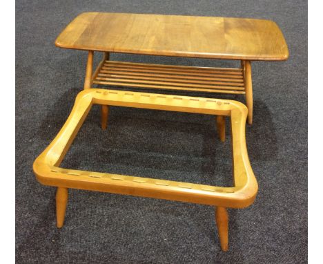 Ercol Furniture - A coffee table with elm top of rounded rectangular form above a beech spindle under-tier, height 37cm and w