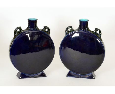 Minton's Art Pottery - A pair of late 19th Century moonflasks, each of flattened circular form with loop handles and raised t