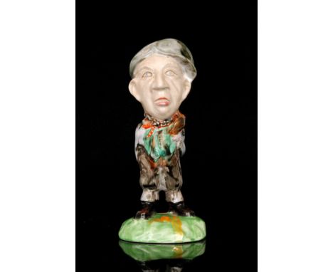 Clarice Cliff - Coal Miner - A novelty caricature figure of a coal miner circa 1936 picked out in enamel colours, large scrip