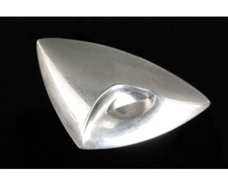 Georg Jensen - A Danish Sterling silver brooch of abstract triangular form with indented central oval, number 473, length 6cm