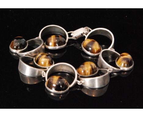 Unknown - A 1970s Scandinavian Sterling silver and tigers eye link bracelet formed as seven off set moon shaped links, each t