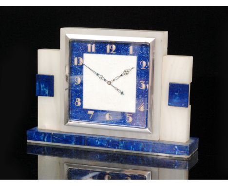 Unknown - A 1930s Art Deco white alabaster and lapis lazuli mantle clock of stepped form with a square enamel dial within a s