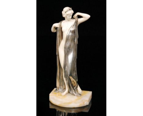 Ernst Seger - A silver and ivory figure titled Phryne, circa 1920, modelled as a classical female figure disrobing, raised on