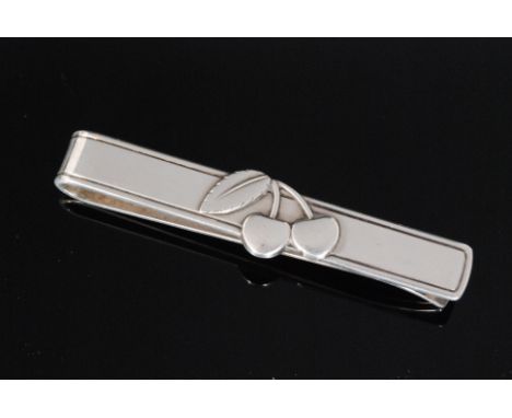 Georg Jensen - A Danish Sterling silver tie slide, with cast cherry decoration and engraved Cherry Heering, designed as a  pr