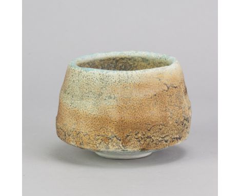 JACK DOHERTY (born 1948) for Leach Pottery; a porcelain bowl covered in soda vapour glaze, impressed J and pottery marks, mad