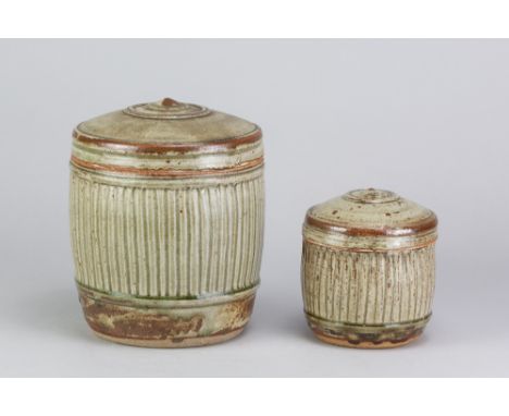 RICHARD BATTERHAM (1936-2021); a stoneware fluted caddy covered in green ash glaze, height 17.5cm, and a smaller example, hei