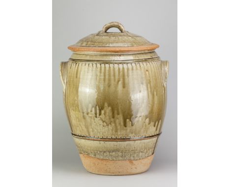 RICHARD BATTERHAM (1936-2021); a large stoneware beer jar and cover covered in green ash glaze, height 53.5cm. (D)Additional 