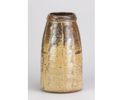 BERNARD LEACH (1887-1979) for Leach Pottery; a tall stoneware vase covered in iron and oatmeal glaze with combed decoration, 