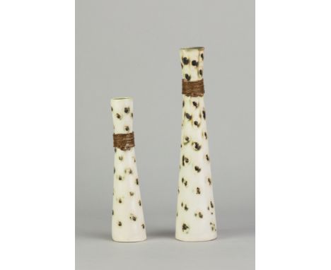 JILL FORD; a porcelain candlestick, incised JF mark, height 27cm, and a smaller example, height 20cm (2). (D)

Provenance: Pu