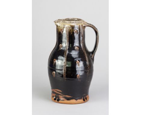 JIM MALONE (born 1946); a large stoneware baluster jug covered in tenmoku breaking to kaki glaze with incised decoration and 