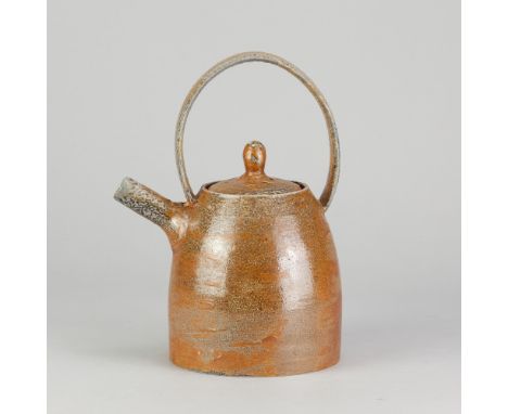 MARTHA OPHER; a salt glazed teapot with strap handle, height 23.5cm. (D)Additional InformationGlaze miss between handle and s