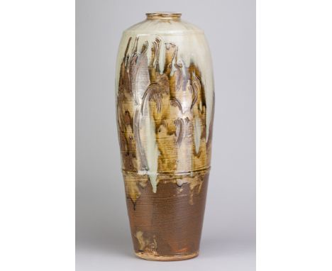 JIM MALONE (born 1946); a very tall stoneware bottle covered in green ash and kaki glaze with incised decoration and nuka top