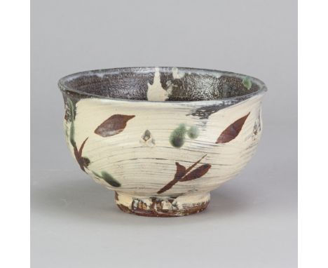 JIM MALONE (born 1946); a stoneware chawan covered in brushed slip with iron and copper green decoration, impressed JM and L 