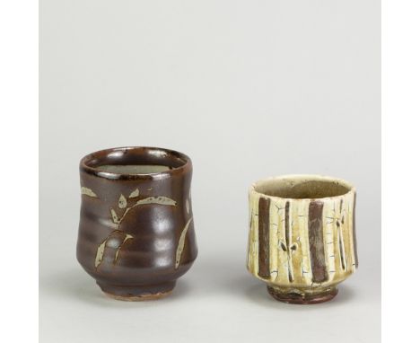 MIKE DODD (born 1943); a stoneware yunomi covered in kaki glaze with wax resist decoration, impressed MJD mark, height 10.5cm