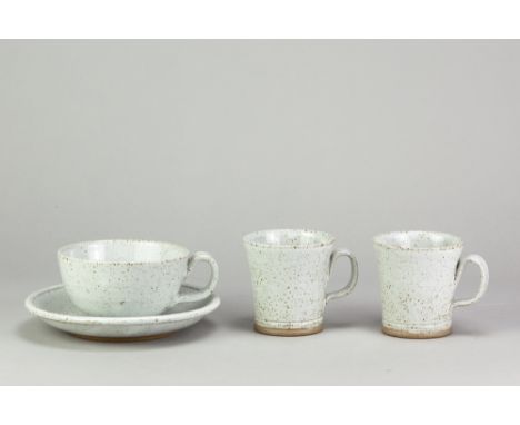 JACK WELBOURNE; a pair of stoneware mugs covered in speckled grey glaze, impressed marks, height 8cm, and a matching cup and 