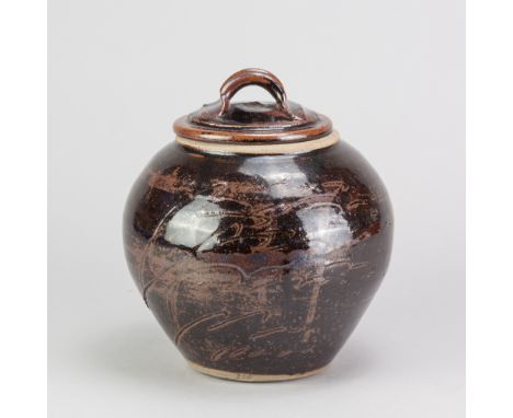 JIM MALONE (born 1946); a stoneware jar and cover covered in tenmoku breaking to kaki glaze with incised decoration, impresse