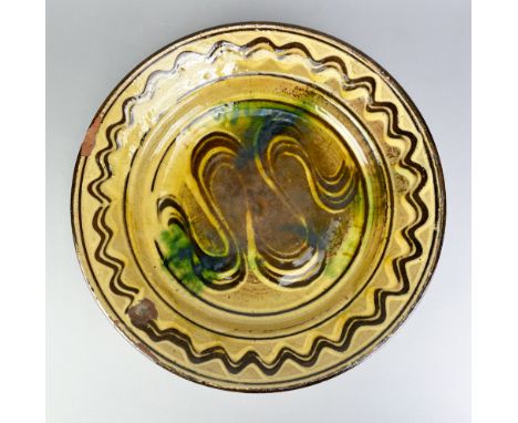 MICHAEL CARDEW (1901-1983) for Winchcombe Pottery; a slipware charger with meander decoration, impressed MC and pottery marks
