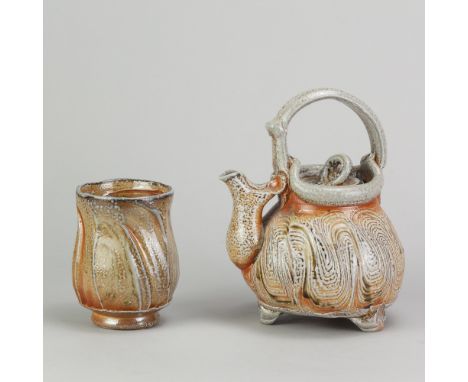 RUTHANNE TUDBALL (born 1948); a stoneware teapot with loop handle covered in soda glaze with incised decoration, impressed RA