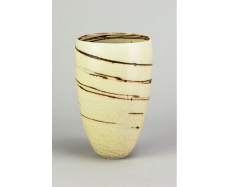 JOANNA CONSTANTINIDIS (1927-2000); a porcelain oval vessel covered in mottled oatmeal glaze with integral iron spiral decorat