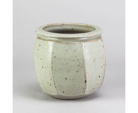 DAVID LLOYD JONES (1928-1994); a stoneware cut sided jar covered in pale grey glaze with iron spots, impressed LJ mark, heigh
